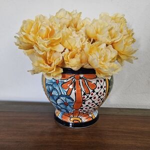 Vibrant Talavera Pottery with Yellow Floral Arrangement